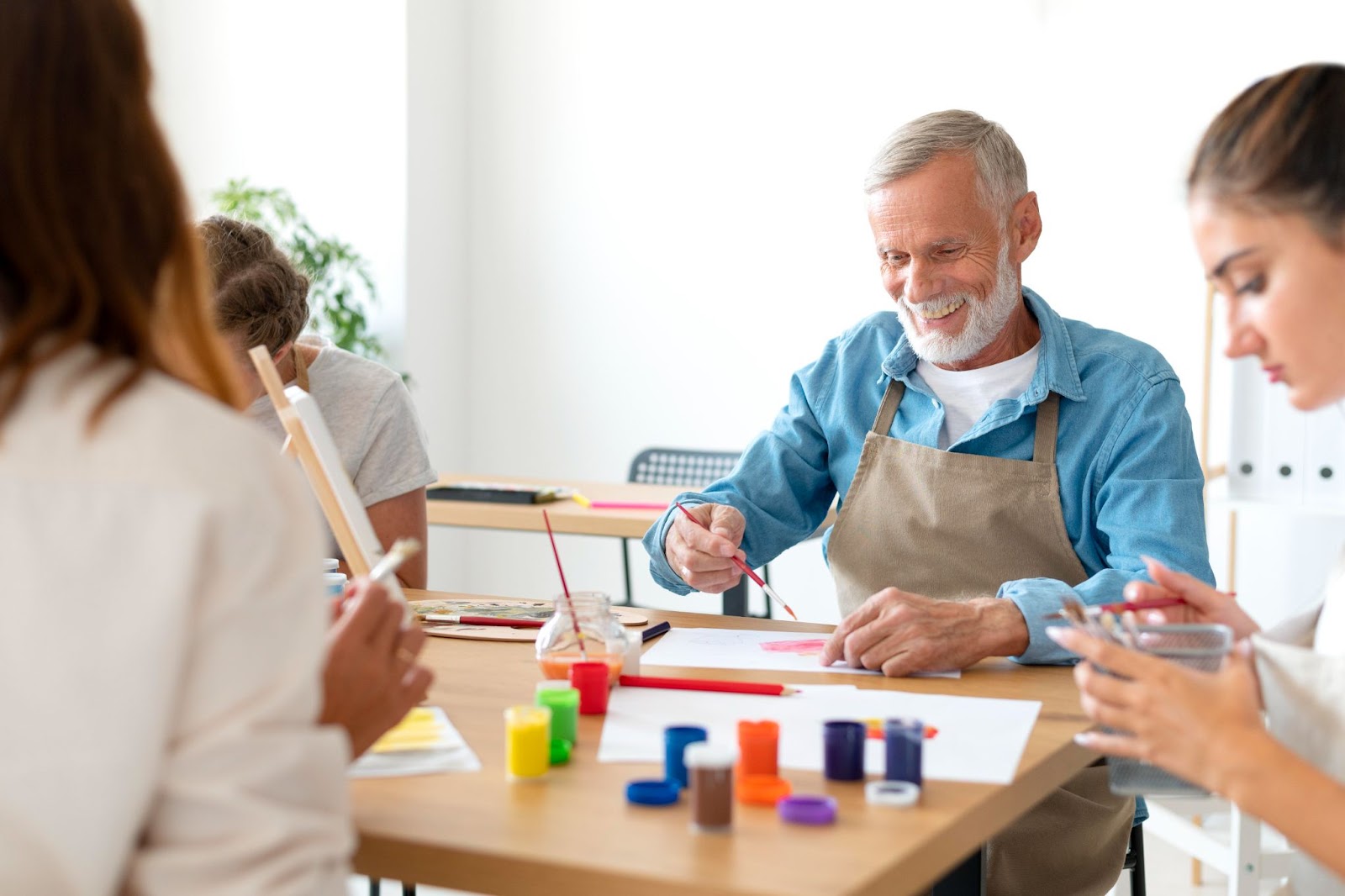 People meeting and painting at a community center